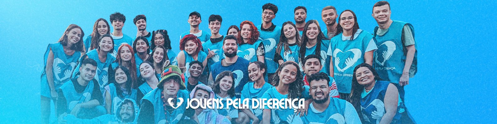 Voluntários do Jovens Pela Diferença reunidos, de colete azul com o símbolo do coração e das mãos.